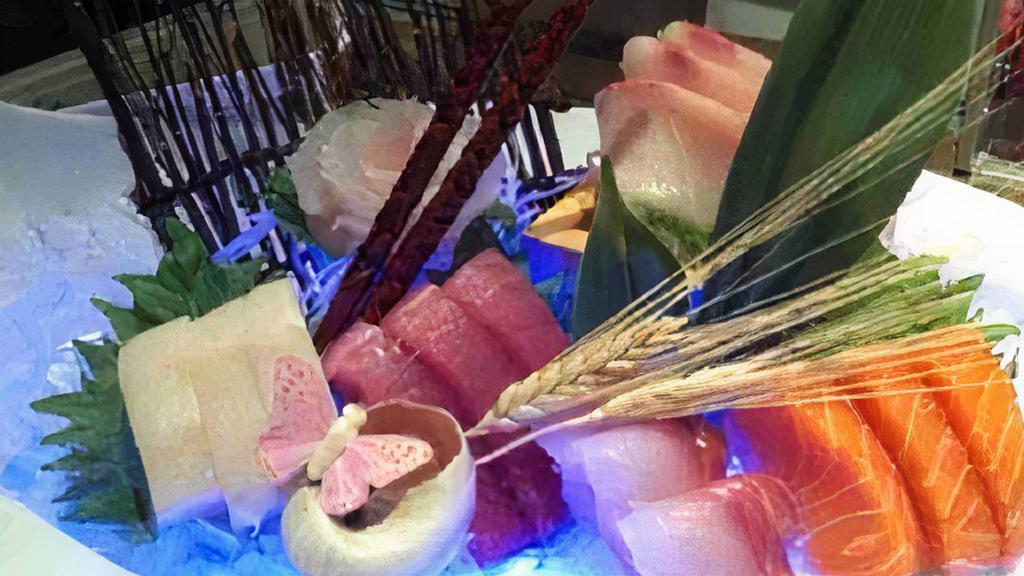 Sashimi Deluxe · 18 pcs of assorted sashimi w. Rice.