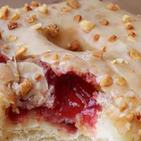Pb&J* · Yeast doughnut with peanut butter glaze, strawberry jam filling, topped with chopped peanuts.