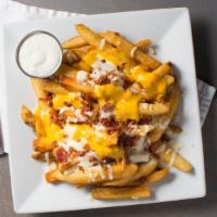 Super Fries · Smothered in cheese whiz topped with bacon & mozzarella cheese. Served with a side of ranch.