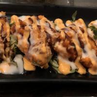 Rock 'N' Roll (8 Pieces) · Shrimp tempura and avocado topped with spicy salmon and masago. Drizzled in special sauce.