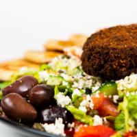 Falafel Greek Salad · A big greek salad with crispy house-made falafel.