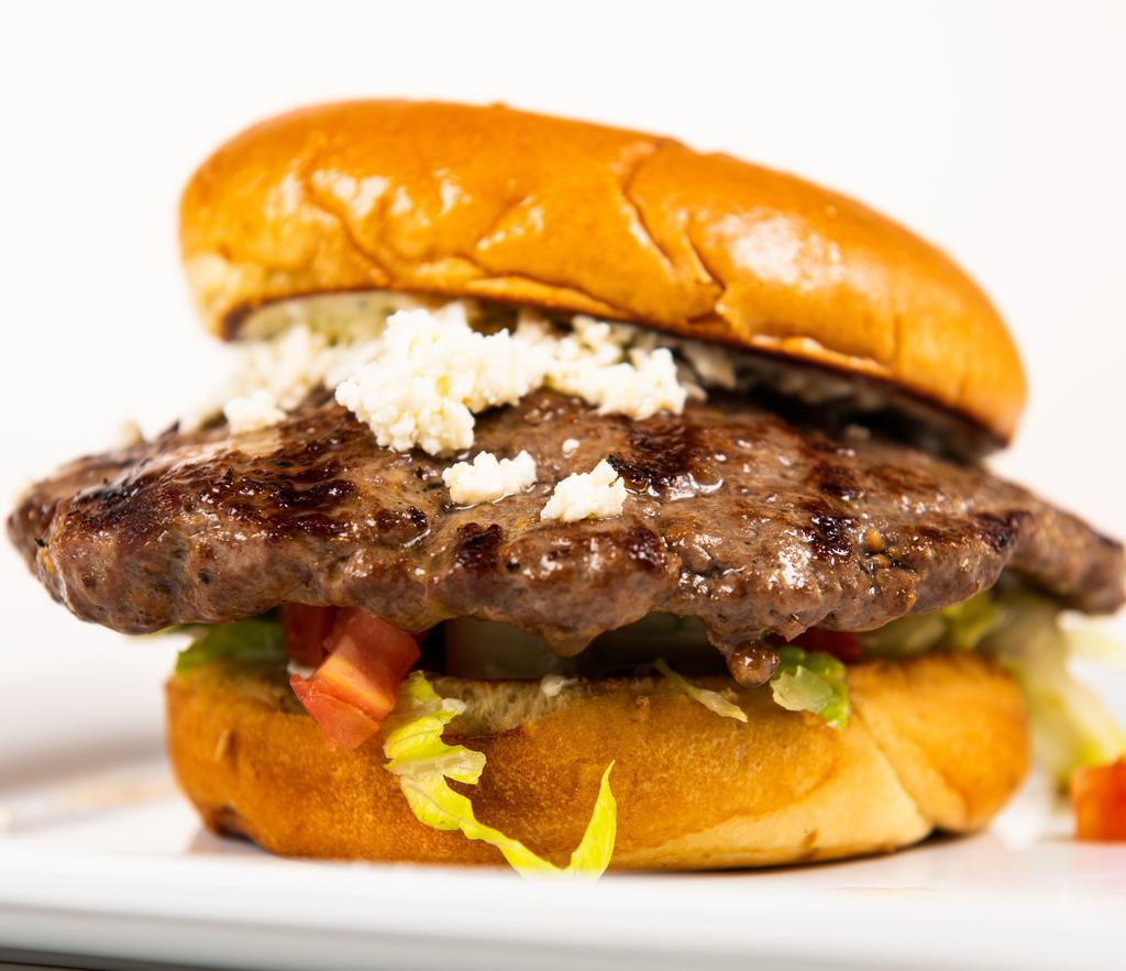 Hercules Burger · Seasoned beef burger with tzatziki, Feta cheese, lettuce, and tomato on a brioche bun.