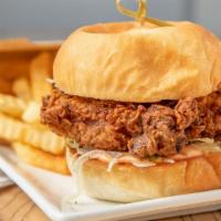 Fried Chicken Sandwich · brined chicken thigh || secret spices || shaved lettuce || pickles || tomato aioli || house-...