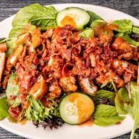 Buffalo Chicken Salad · Garden salad topped with buffalo chicken pieces and real bacon crumbles. Served with bleu ch...