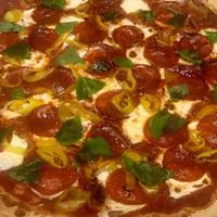Spicy Margherita Pizza · Fresh mozzarella, fresh basil, hot pepper rings, pepperoni, imported Parmesan cheese and sau...