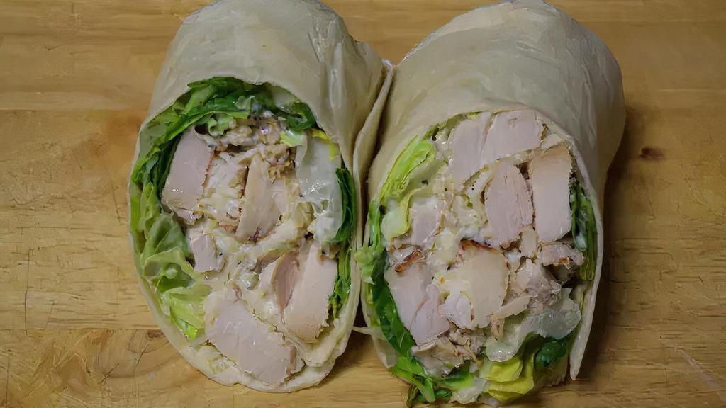 Chicken Caesar Wrap · Grilled chicken, lettuce, imported Parmesan cheese and Caesar dressing.