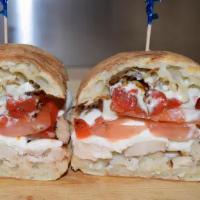 Chicken Caprese Panini · Grilled chicken, fresh mozzarella, roasted peppers, tomatoes, olive oil and balsamic reducti...