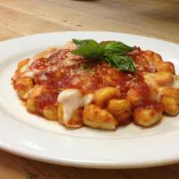 Gnocchi Caprese · Potato pasta tossed in marinara sauce and topped with melted provolone cheese. Served with g...