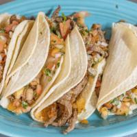 Tacos Azteca  · Four soft white corn tortilla tacos, Consisting of grilled steak Mexican sausage and pico de...