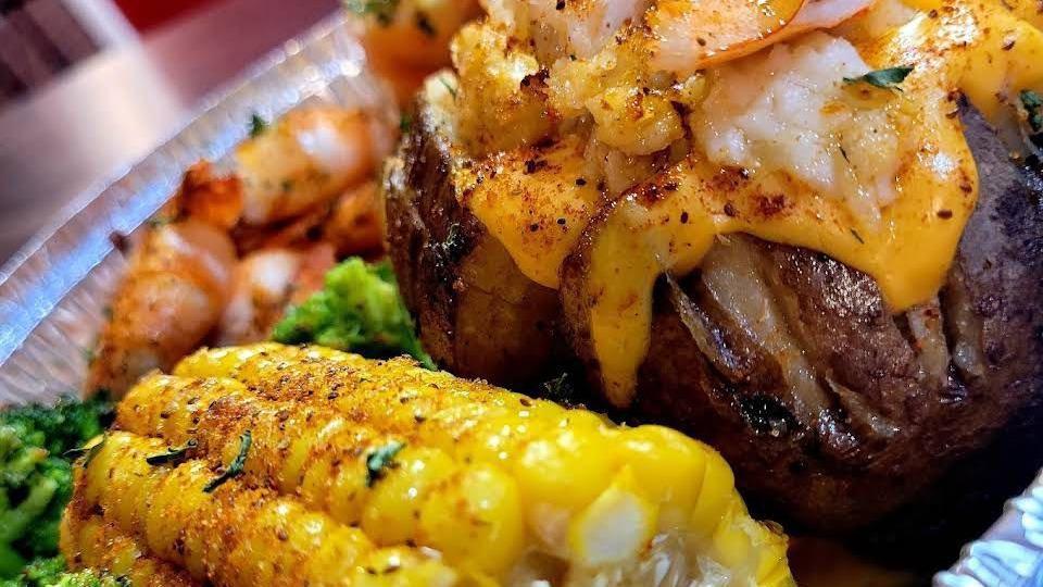 Cheesy Crab Bp Platter · Comes with baked potatoes, corn, and shrimp.