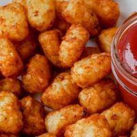 Tater Tots · Order of Tater Tots served with side of ketchup.