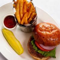 Impossible Burger · Vegan, Plant-Based Patty served on a brioche bun with lettuce, tomato, red onion, pub fries,...