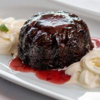 Chocolate Lava Cake · rich chocolate cake stuffed with a soft molten chocolate center, served hot with strawberry ...
