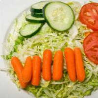 House Salad · Salad greens topped with chopped cucumbers & tomatoes, and baby petite carrots.
