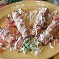 Burrito · All burritos are wrapped in a soft flour tortilla with Mexican rice, beans, and your choice ...
