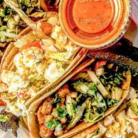 Tacos (3) · 3 double stacked Corn tortillas. Filled with your choice of meat, Traditional- Cilantro & On...
