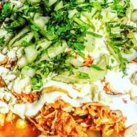 Huarache · Soft-opened faced large fresh tortilla topped with refried beans, choice of meat, crumbled q...