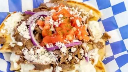 Greek Nacho Bowl  · Fluffy grilled pitas topped with gyro or chicken meat, homemade tzatziki sauce, feta cheese, onions, tomatoes