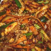 O Jing Eo Bokkeum · Stir-fried squid with onion served in spicy sauce.