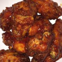 Chicken Wings (10 Pcs) · Delicious saucy crispy chicken wings