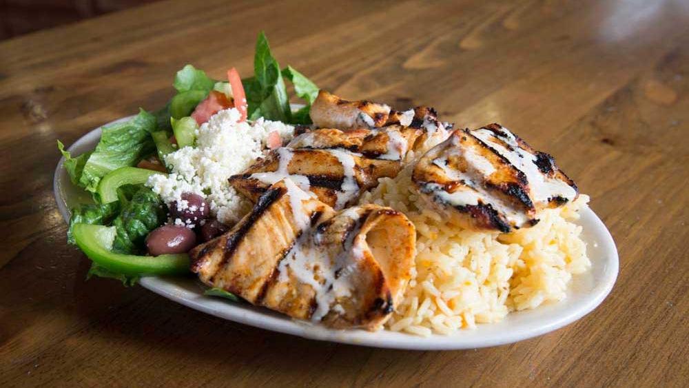 Chicken Kabob Plate  · Grilled chicken in Moroccan spices. Served with rice and a Mediterranean salad. Add extra for an additional charge.