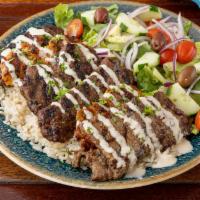 Delux Kabob Plate  · Two chicken kabob, two lamb kabob, two kafta kabob, severed over rice and Mediterranean salad.
