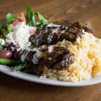 Kafta Kabob Plate · Ground beef tossed in moroccan spices. Served with rice and a Mediterranean salad.