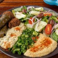 Special #6 Sampler Plate · Sampler plate served with hummus, tabouli, 2 falafel, 2 grape leaves and pita bread.