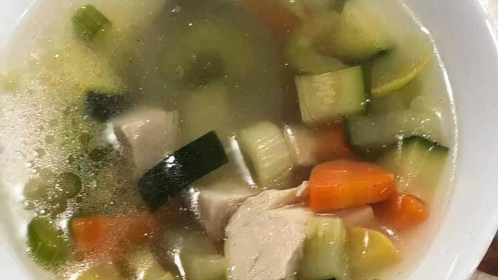 Chicken Noodle With Vegetable Soup · Clear chicken broth with pieces of chicken and noodles.