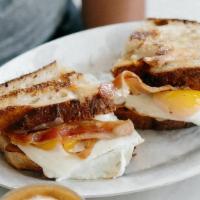 Breakfast Sandwich · Eggs your style, Vermont cheddar, and applewood smoked bacon on housemade sourdough. . Conta...