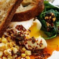Spinach, Corn & Egg Plate · Sauteed spinach, fresh corn, and poached egg served over garlic labneh and topped with Alepp...