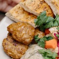Lamb Kebab Plate · Lamb kebab, baba ganoush, chickpea puree, pickled red cabbage, carrots, and cauliflower serv...
