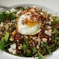 Summer Farro Bowl · Warm farro, tossed with corn, green fava, alfalfa sprouts, and parsley relish, topped with g...