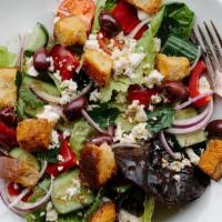 Fattoush Salad · Bibb and red leaf lettuce, tomato, cucumber, red pepper, onion, kalamata olives, sunflower s...