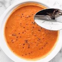 Tomato Soup · Our famous tomato soup. Creamy, rich, and bursting with flavor. Served with a housemade roll...