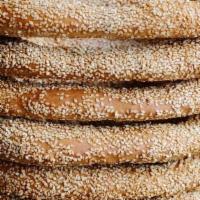 Jerusalem Bagel · Traditional soft, sweet Israeli pastry dipped in simple syrup and coated in sesame.. Contain...