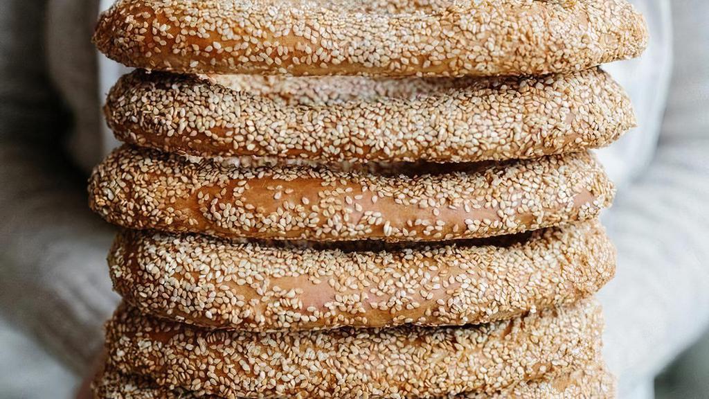 Jerusalem Bagel · Traditional soft, sweet Israeli pastry dipped in simple syrup and coated in sesame.. Contains: Wheat, Sesame