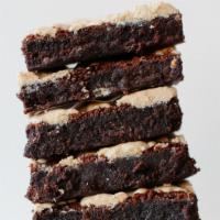 Halva Brownie (Gf) · Rich, chocolaty flourless brownies made with Valrhona chocolate.. Contains: Dairy, Egg, Soy,...