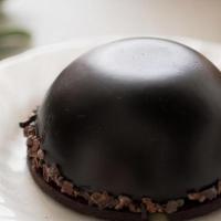Halva Bomb (Gf) · Whipped milk chocolate ganache surrounds a vanilla halva center on top of a crisp chocolate ...