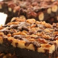 Walnut Brownie (Gf) · Rich, chocolaty flourless brownies made with Valrhona chocolate.. Contains: Dairy, Egg, Soy,...