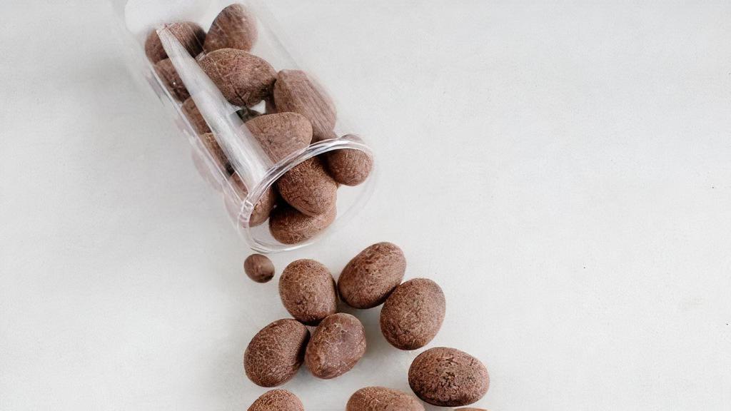 Valrhona Dark Chocolate Almonds (Gf) · The perfect gift for chocolate and nuts lover. Our housemade Valrhona chocolate-coated caramelized almonds. | One tube. Contains: Soy, Tree Nut (Almond)