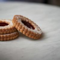 Linzer Cookie · Sandwich cookies made with our signature butter cookie dough, filled with housemade jam, dus...