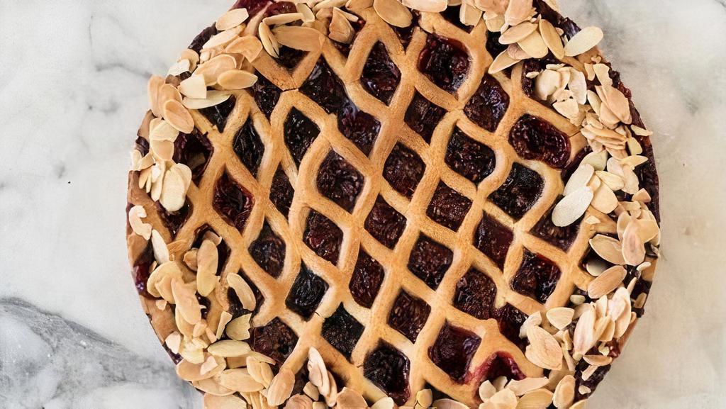 Mixed Berry Linzer Tart Slice · Tart mixture of raspberries and blackberries rest on our rich, buttery pie crust.. Contains: Wheat, Dairy, Egg,  Tree Nut (Almond)