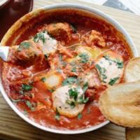 Gf Traditional Shakshuka · Traditional North African dish with tomato sauce, bell pepper, eggs, and feta cheese served ...