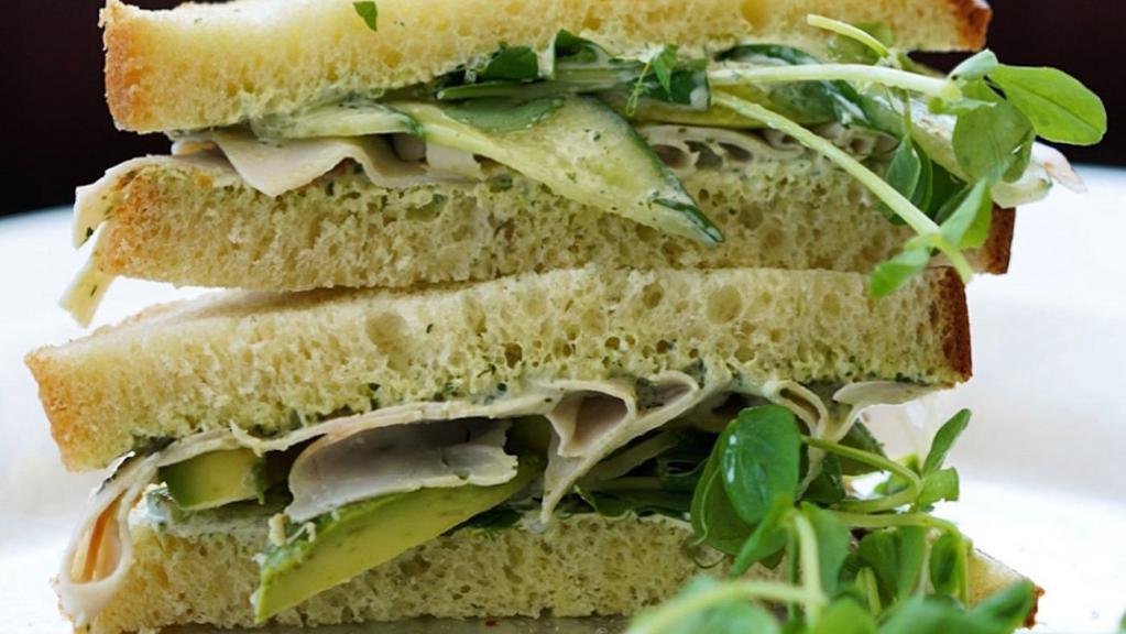 Gf Turkey Avocado Sandwich · Turkey, avocado, Ward's Berry pea shoots, cucumbers and green herb dressing on gluten-free bread.. Contains: Dairy, Egg, Soy