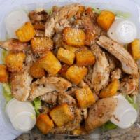 Chicken Caesar Salad · Romaine lettuce tossed with caesar dressing, croutons, Parmesan cheese, and hot chicken brea...