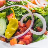 Garden Salad · Iceberg lettuce, cucumbers, carrots, pepperoncini, red onion, tomatoes, olives.