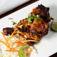 Tangdi Kebab · Chicken drumsticks generously marinated with aromatic spices and char-grilled to perfection.