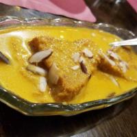 Shahi Tukda · Double ka meetha. Ghee roasted bread pieces soaked and cooked in saffron milk. Served hot.