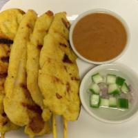 Chicken Satay · Chicken grilled on skewers served with specially prepared peanut sauce and sweet cucumber sa...
